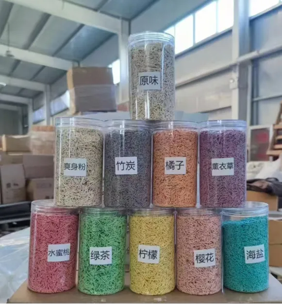 Stacked clear jars filled with colorful pellet cat litter