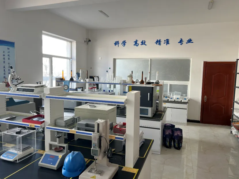 Manufacturing quality control laboratory equipped with product testing instruments and scales on workbenches